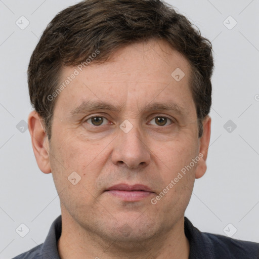 Joyful white adult male with short  brown hair and grey eyes