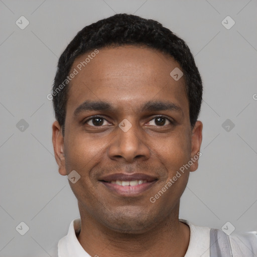 Joyful black young-adult male with short  black hair and brown eyes