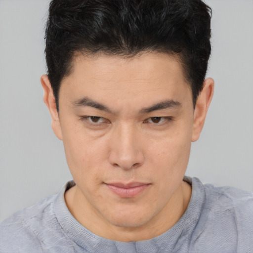 Neutral asian young-adult male with short  brown hair and brown eyes