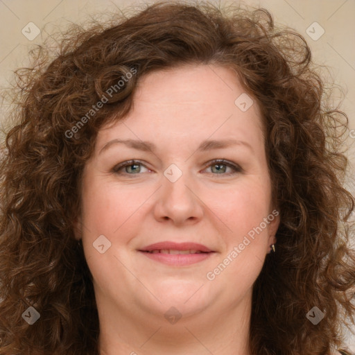 Joyful white adult female with long  brown hair and brown eyes