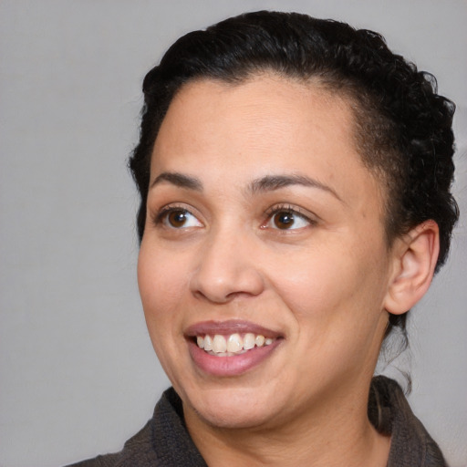 Joyful white young-adult female with short  black hair and brown eyes
