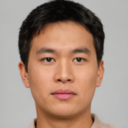 Neutral asian young-adult male with short  brown hair and brown eyes