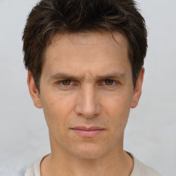 Neutral white adult male with short  brown hair and brown eyes