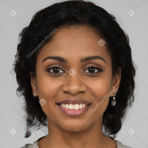 Joyful black young-adult female with medium  black hair and brown eyes