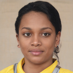 Joyful latino young-adult female with short  brown hair and brown eyes