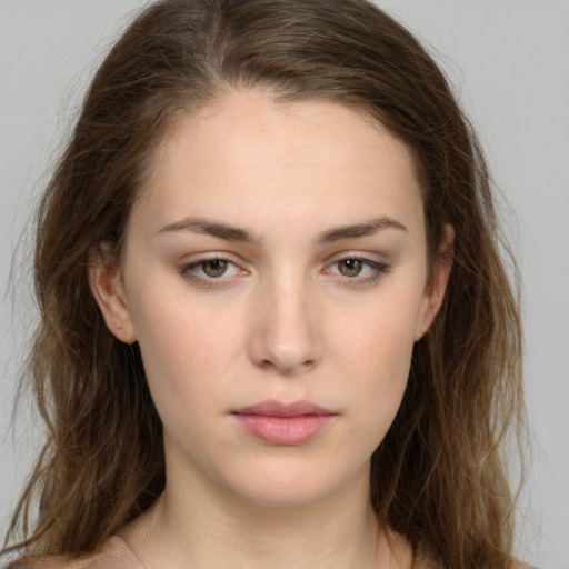 Neutral white young-adult female with long  brown hair and brown eyes