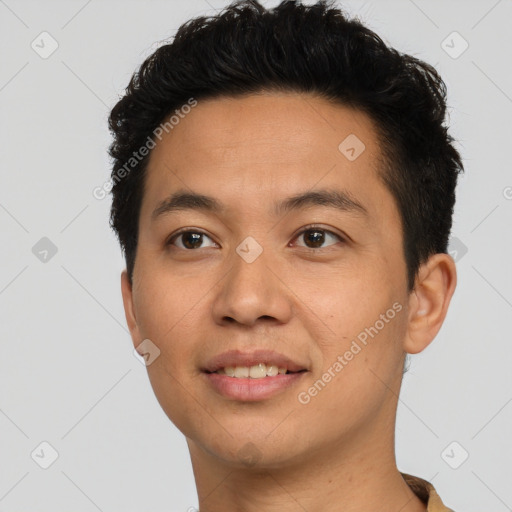 Joyful latino young-adult male with short  black hair and brown eyes