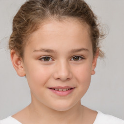 Joyful white child female with short  brown hair and brown eyes