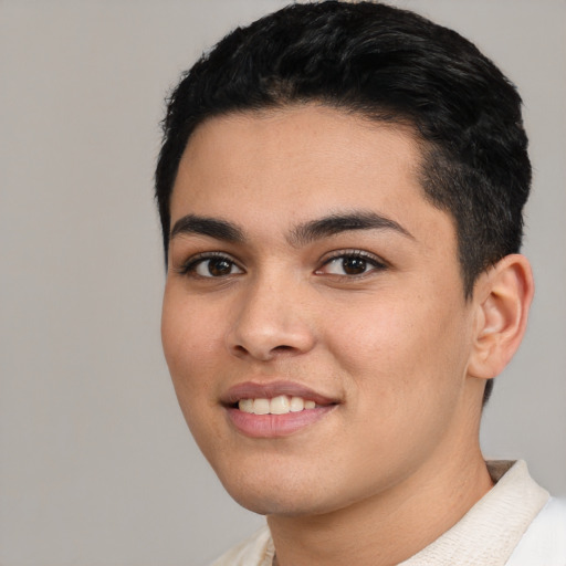 Joyful latino young-adult male with short  black hair and brown eyes