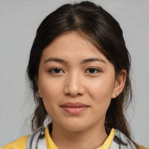 Joyful white young-adult female with medium  brown hair and brown eyes