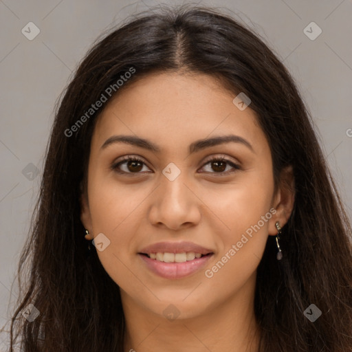 Joyful latino young-adult female with long  brown hair and brown eyes