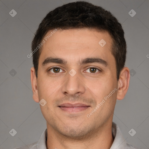 Joyful white young-adult male with short  brown hair and brown eyes