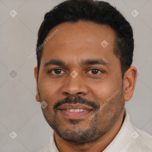 Joyful black young-adult male with short  black hair and brown eyes