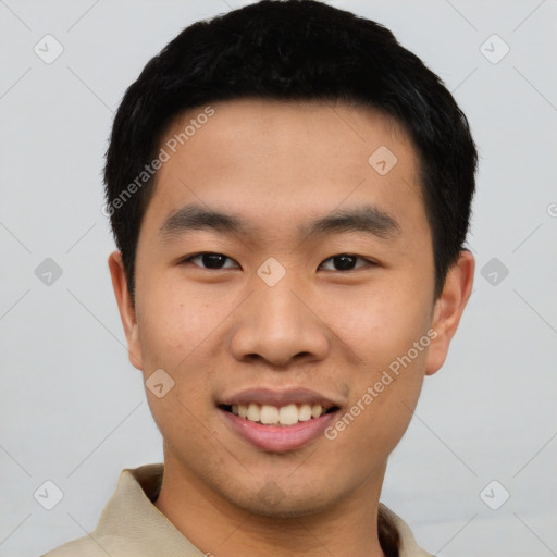 Joyful asian young-adult male with short  black hair and brown eyes