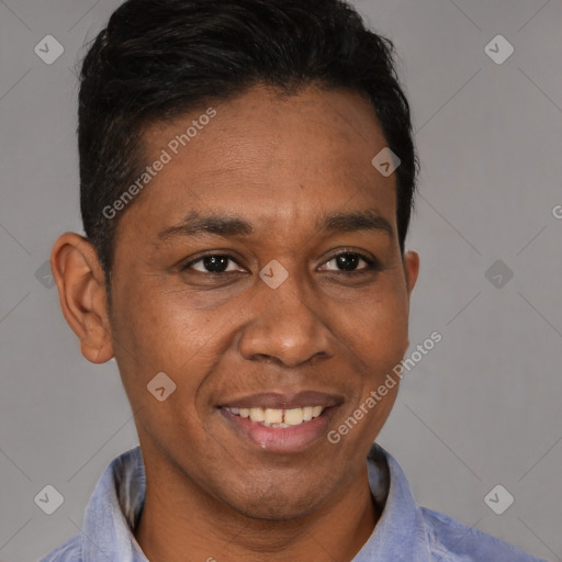 Joyful black young-adult male with short  brown hair and brown eyes