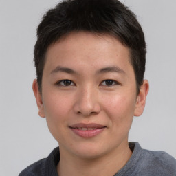 Joyful asian young-adult female with short  brown hair and brown eyes