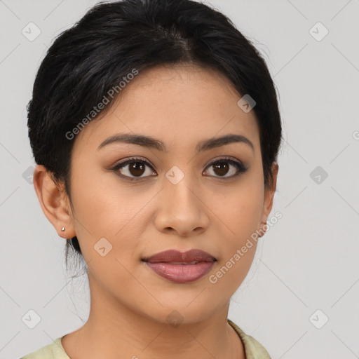 Joyful latino young-adult female with medium  brown hair and brown eyes