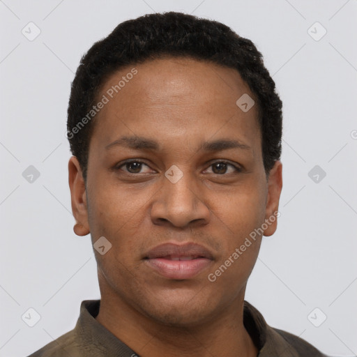 Joyful black young-adult male with short  black hair and brown eyes