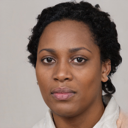 Neutral black young-adult female with medium  black hair and brown eyes