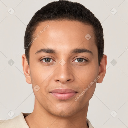 Joyful latino young-adult male with short  brown hair and brown eyes