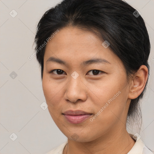 Joyful asian young-adult female with medium  brown hair and brown eyes