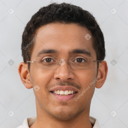 Joyful latino young-adult male with short  brown hair and brown eyes