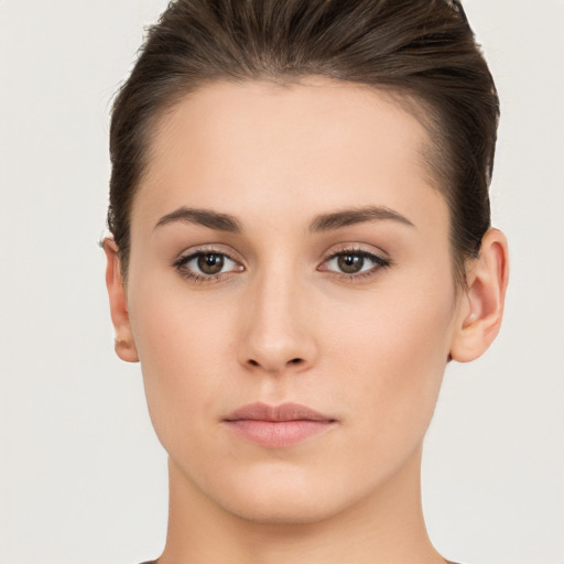 Neutral white young-adult female with short  brown hair and brown eyes