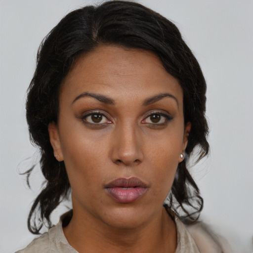 Neutral black young-adult female with medium  brown hair and brown eyes