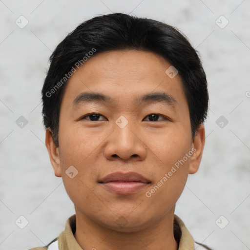 Joyful asian young-adult male with short  black hair and brown eyes