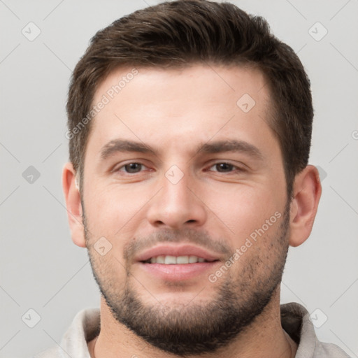 Joyful white young-adult male with short  brown hair and brown eyes