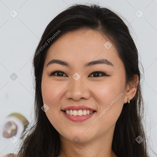 Joyful asian young-adult female with long  brown hair and brown eyes