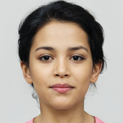 Joyful latino young-adult female with medium  brown hair and brown eyes