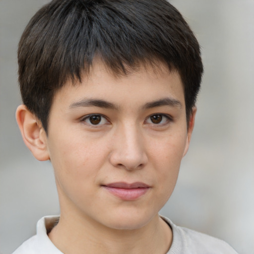 Joyful white child male with short  brown hair and brown eyes