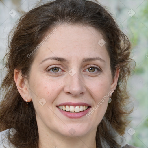 Joyful white adult female with medium  brown hair and green eyes