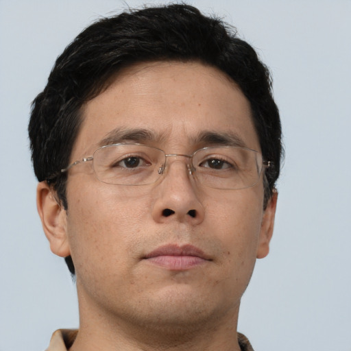 Neutral asian adult male with short  brown hair and brown eyes