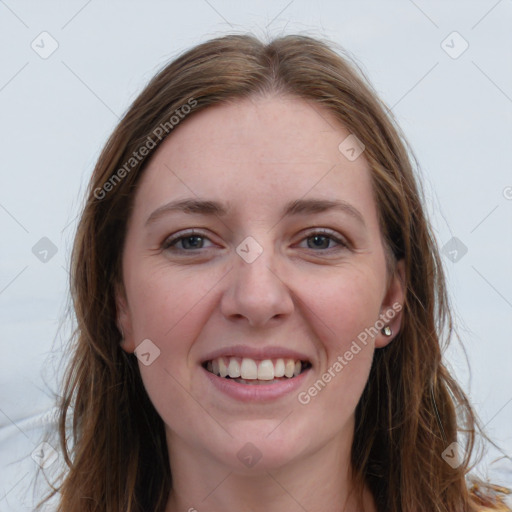 Joyful white young-adult female with long  brown hair and blue eyes