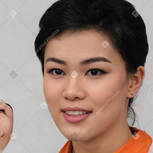 Joyful asian young-adult female with short  black hair and brown eyes