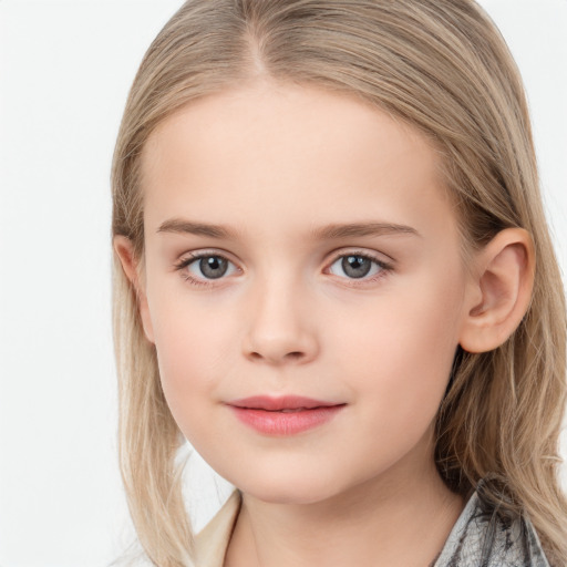 Joyful white child female with long  brown hair and blue eyes