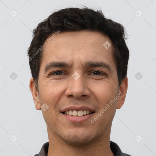 Joyful white young-adult male with short  brown hair and brown eyes