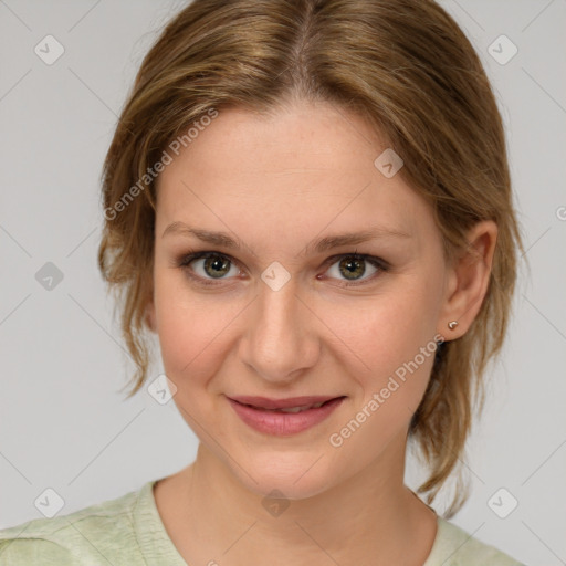 Joyful white young-adult female with medium  brown hair and green eyes