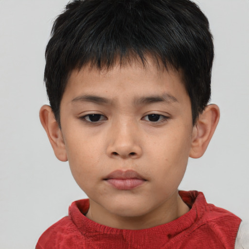 Neutral asian child male with short  brown hair and brown eyes