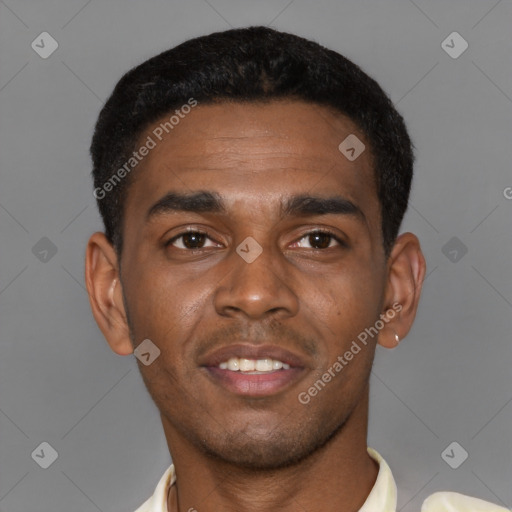 Joyful latino young-adult male with short  brown hair and brown eyes