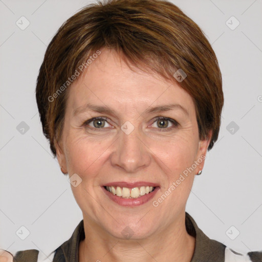 Joyful white adult female with medium  brown hair and grey eyes