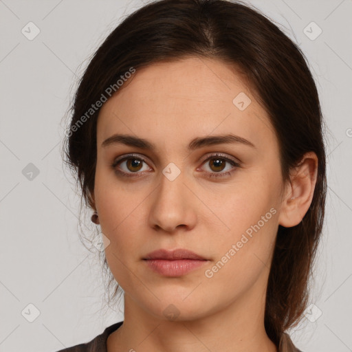 Neutral white young-adult female with long  brown hair and brown eyes