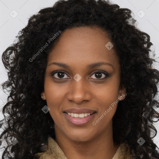 Joyful black young-adult female with long  brown hair and brown eyes