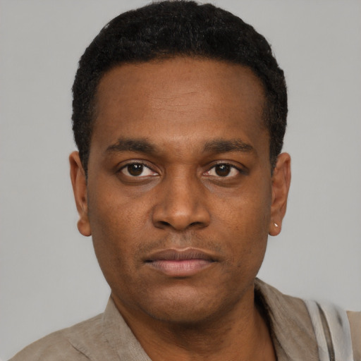 Neutral black young-adult male with short  black hair and brown eyes