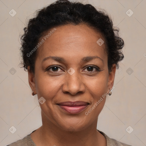 Joyful black adult female with short  brown hair and brown eyes