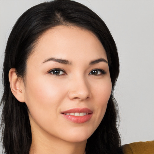 Joyful white young-adult female with long  black hair and brown eyes