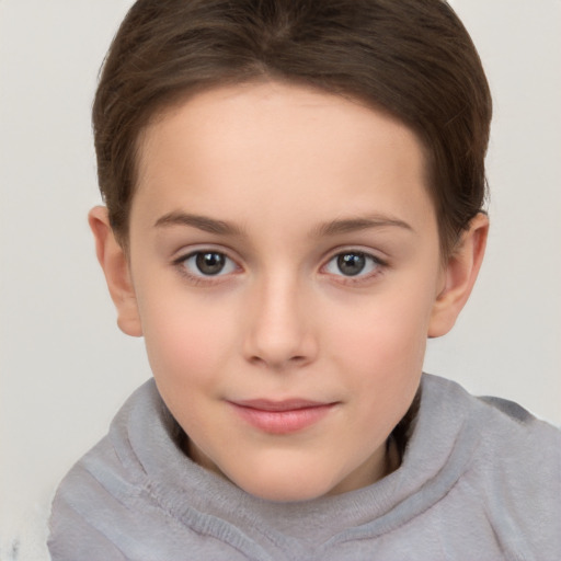 Joyful white child female with short  brown hair and brown eyes