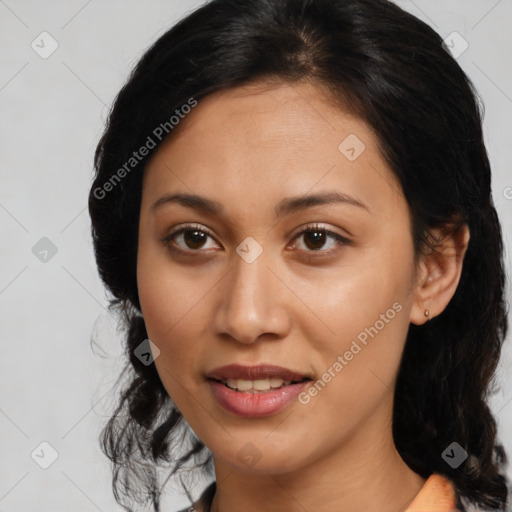 Joyful latino young-adult female with medium  brown hair and brown eyes